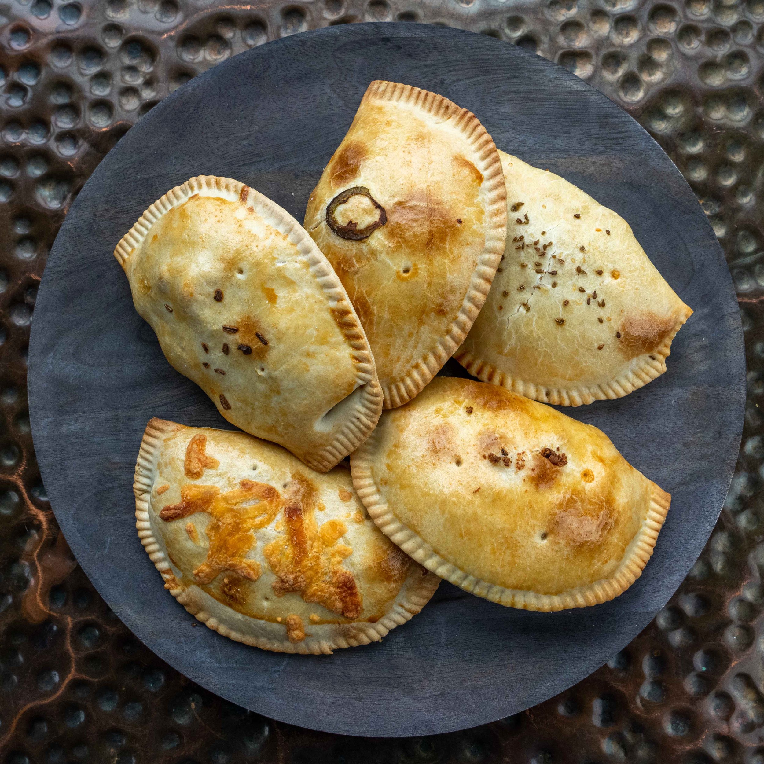 Savor the flavor of the world: Our empanadas range from traditional to innovative, all with a delicious twist.